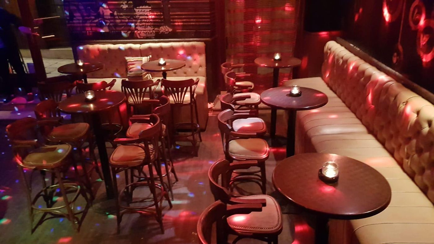 Disco light reflections across the floor of the seating area