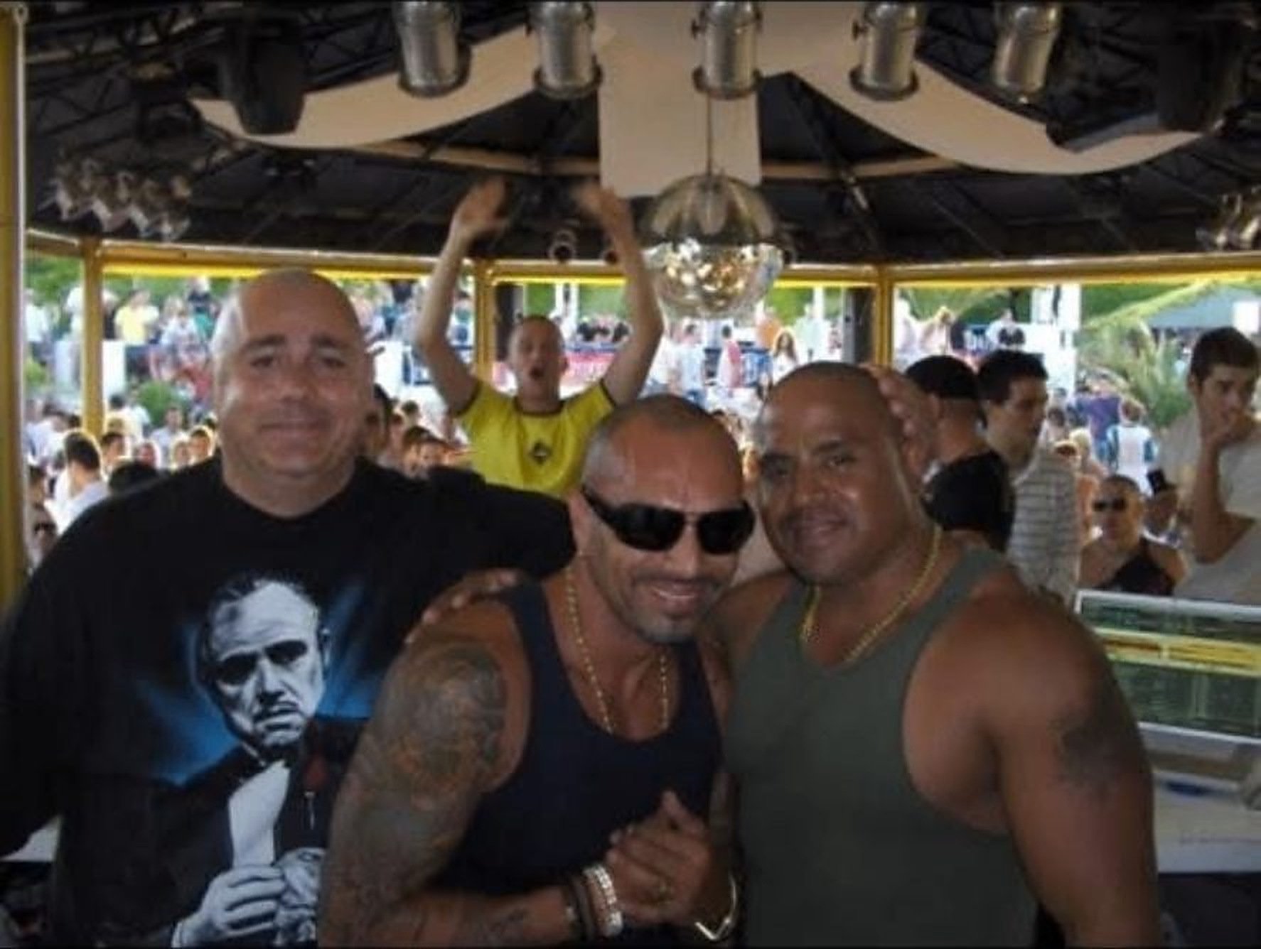 Friends together at an outdoor night at the bar